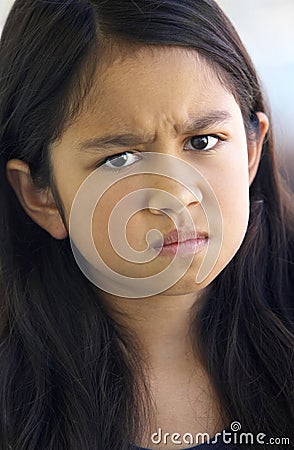 Portrait Of Girl Frowning Stock Photo