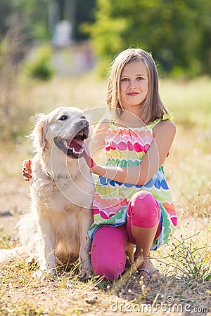 Portrait of a Girl with her beautiful dog outdoors Stock Photo