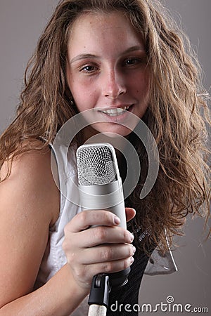 Portrait of a girl with a microphone Stock Photo