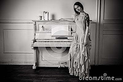 Portrait of a girl about the piano Stock Photo