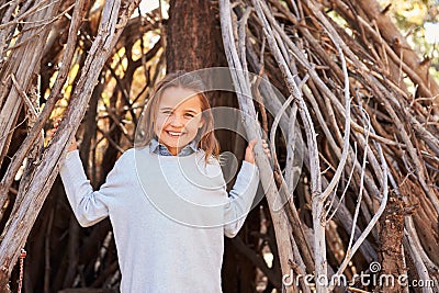 Portrait Of Girl Playing In Forest Camp Stock Photo