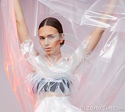 Portrait of a girl in polyethylene. Fashion portrait. Stock Photo