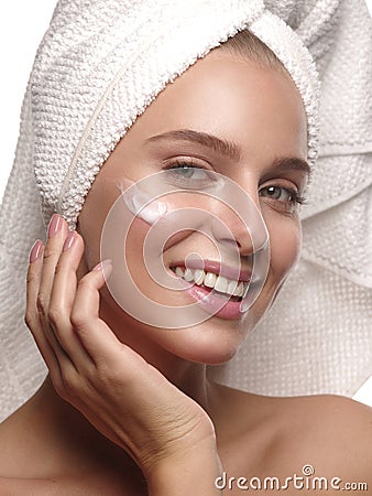 Portrait of a girl with pure and healthy glowing skin without makeup, who is doing daily skincare Stock Photo