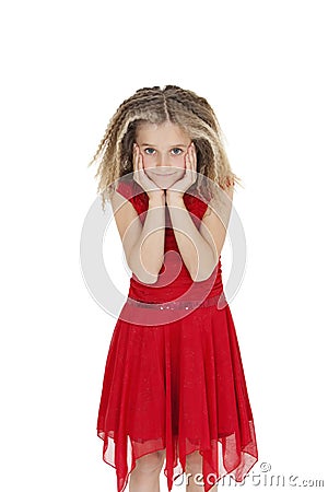 Portrait of girl in red frock with head in hands over white background Stock Photo