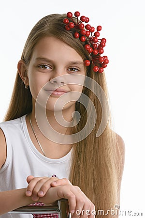 Portrait of a girl of Slavic appearance with a bunch of berries in her hair close-up Stock Photo