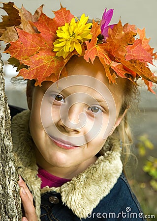 Portrait of a girl wearing a wreath of autumn leav Stock Photo