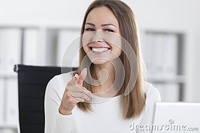 Portrait of a girl in white pointing at you Stock Photo