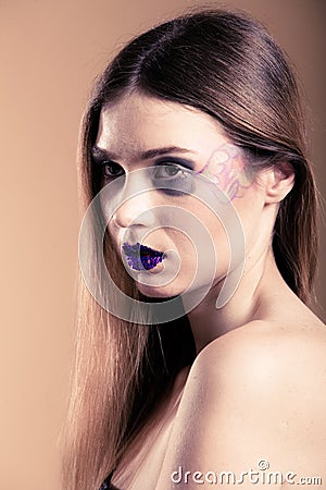 Portrait of girl woman with long straight hair and creative makeup Stock Photo