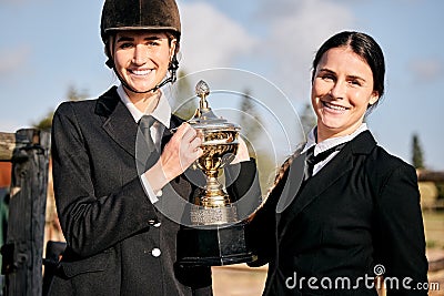 Portrait, girls and champion for equestrian, competition and horse riding with trophy at ranch. Young, women and Stock Photo