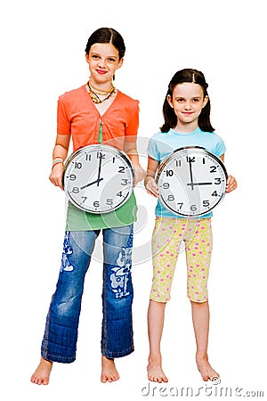 Portrait of girls holding clocks Stock Photo