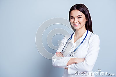 Portrait of glad smiling doctor in white uniform standing with c Stock Photo