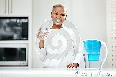 Portrait, glass and black woman drinking water, detox and health with nutrition, happiness and wellness. Face, female Stock Photo