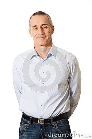 Portrait good looking man holding arms behind him Stock Photo