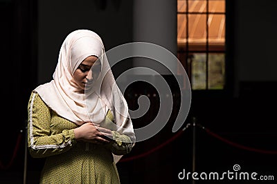 Portrait of a gorgeous humble Muslim woman praying in peace at a mosque Stock Photo