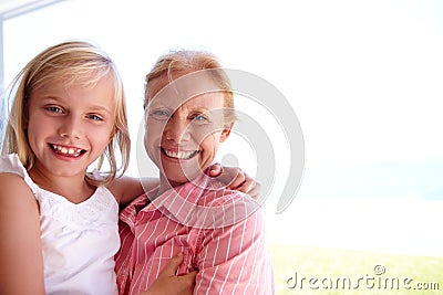 Portrait, grandmother and girl with generations at family house by embrace, bonding and love in garden. Grandma, people Stock Photo