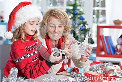 Portrait of grandmother with girl preparing for Christmas Stock Photo