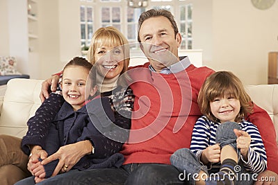 Portrait grandparents and grandchildren at home Stock Photo