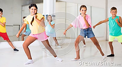 Portrait of group of boys and girls having dancing class in studio Stock Photo