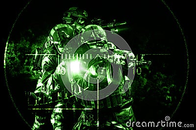 Portrait of a group of commandos in the night sight of a sniper rifle. The concept of military operations, international conflicts Stock Photo