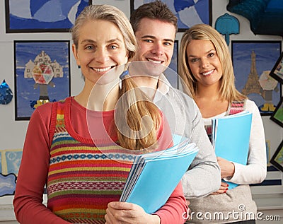 Portrait Of Group Of Teachers In Classroom Stock Photo