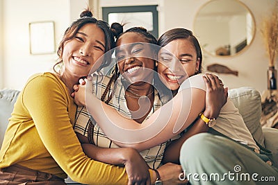 Portrait of a group of women, friends hug on sofa with smile and bonding in living room together in embrace. Hug, love Stock Photo