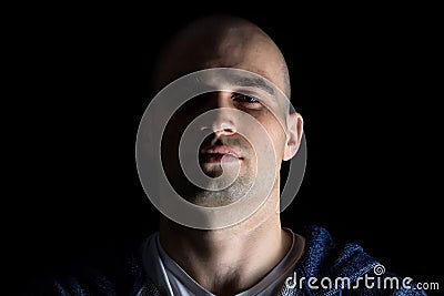 Portrait of hairless man with uplifted chin Stock Photo