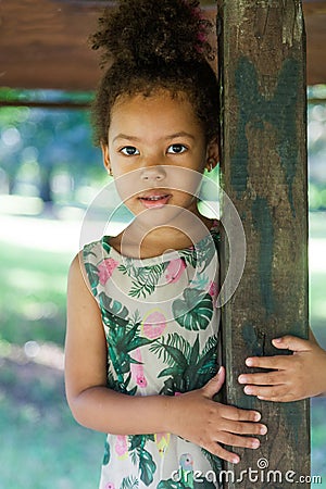 Portrait of half-caste children in park Stock Photo