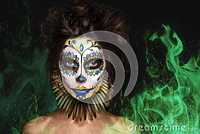 Portrait, halloween girl , dead mexican goddess Los Muertos in fire Stock Photo