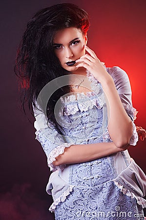 Portrait of halloween vampire woman aristocrat with stage makeup Stock Photo