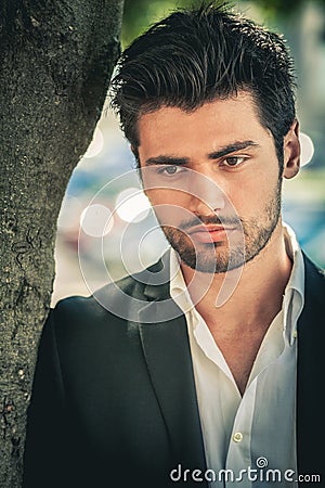 Portrait of handsome and attractive pensive man. Stock Photo