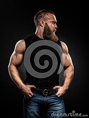 Portrait of handsome bearded man with fashionable hairstyle Stock Photo