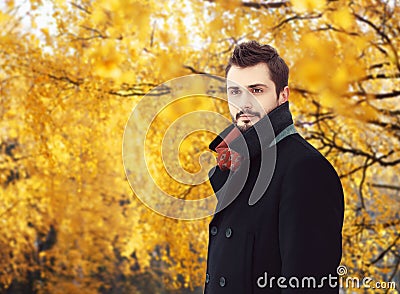 Portrait of handsome bearded man wearing a black coat in autumn Stock Photo