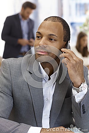 Portrait of handsome businessman on phone Stock Photo