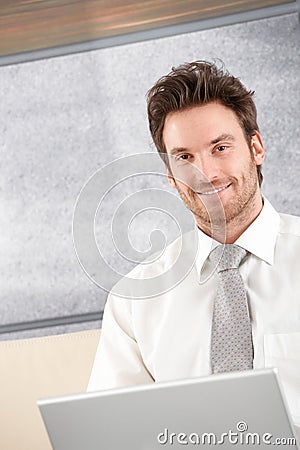 Portrait of handsome businessman smiling Stock Photo