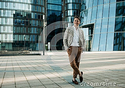 Portrait of an handsome businessman, summer day, outdoors near modern business centre Stock Photo