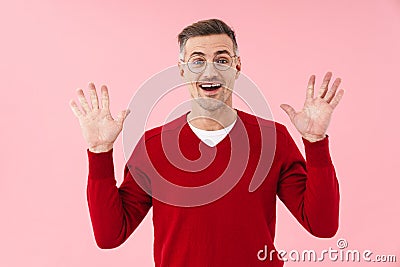 Portrait of handsome man wearing eyeglasses smiling and raising hands Stock Photo