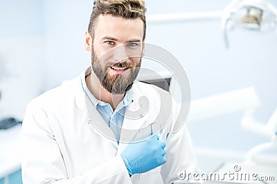 Portrait of handsome dentist Stock Photo