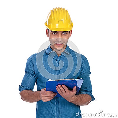Portrait of handsome engineer student holding blue clipboard Stock Photo
