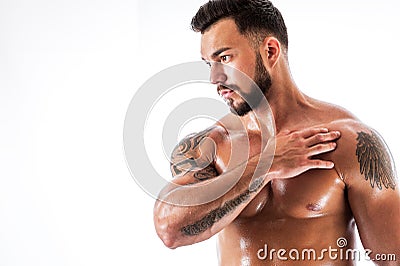 Handsome fitness male model with tattooed torso Stock Photo