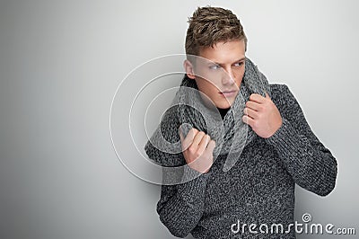 Handsome Man Holding Winter Scarf Stock Photo