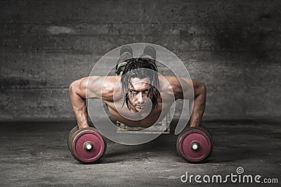 Portrait of handsome man pushing up Stock Photo