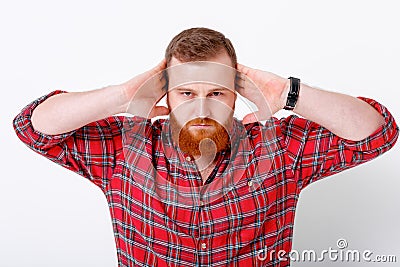 Man with red hair and beard in plaid shirt Stock Photo