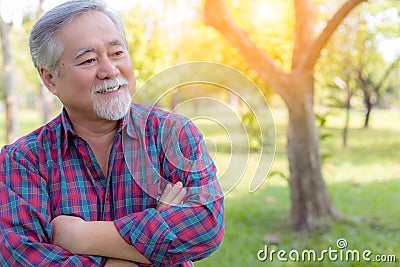 Portrait handsome old man. Attractive handsome grandfather cross arms and proud of his self. Grandpa get successful of his Stock Photo