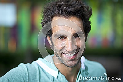 Portrait Of A Handsome Spanish Man Smiling At The Camera Stock Photo