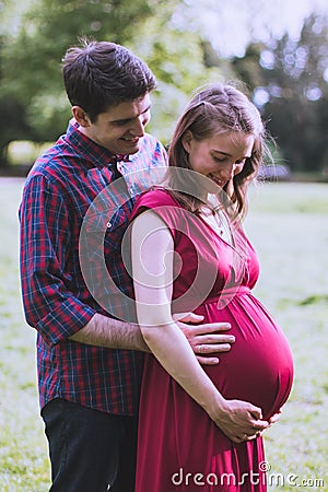 Portrait of a happily married couple expecting a baby Stock Photo