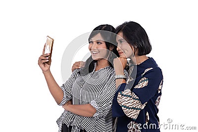 Portrait of happiness young women and her mother selfie with smartphone Stock Photo