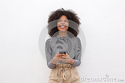 Happy african american woman holding smart phone Stock Photo