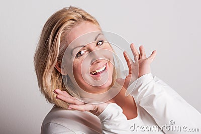 Portrait of an attractive overweight woman in studio on a white background. Stock Photo