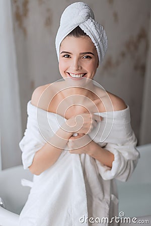 Portrait of happy beautiful woman with brown long hair in bathroom Stock Photo