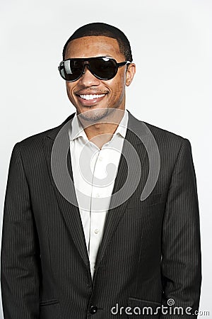 Portrait Of A Happy Black Male In Suit and Sunglasses Stock Photo